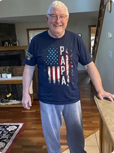 Happy customer wearing Papa flag tee